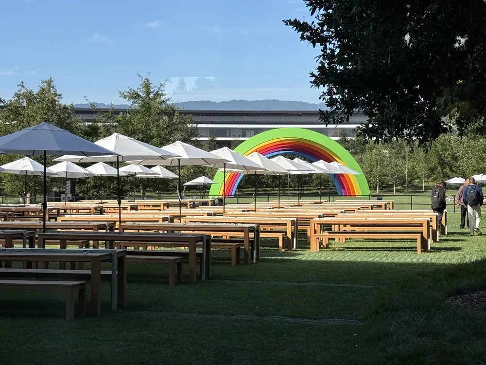 Empty benches and umbrellas on the Apple Park lawn before the keynote